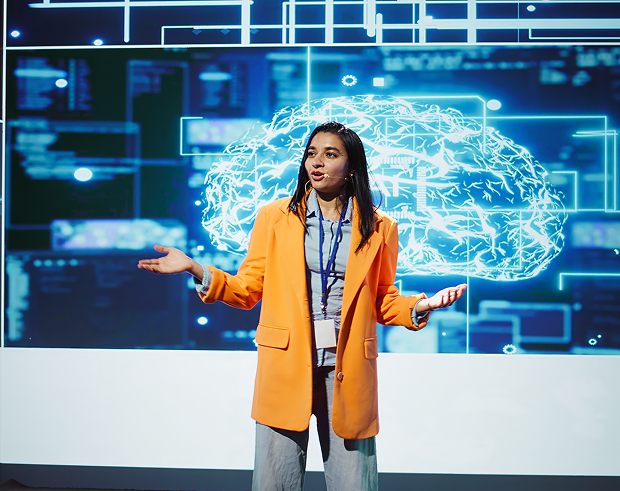 GettyImages-2162596489 A person standing in front of a screen