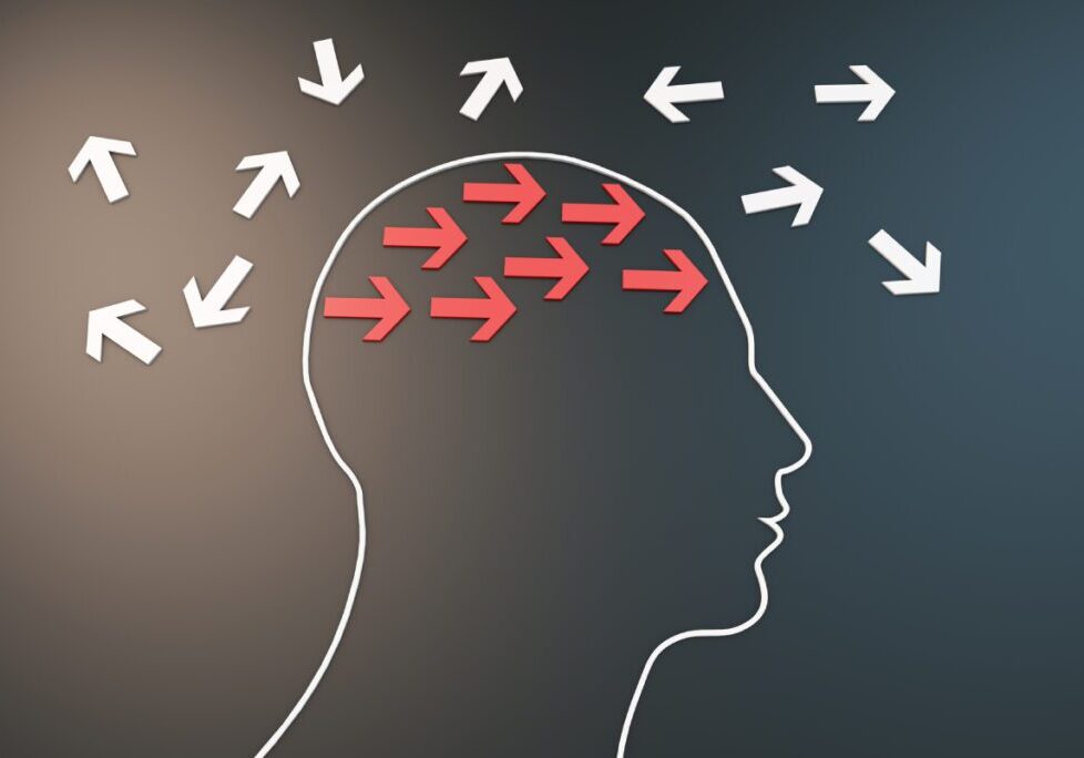 Silhouette with arrows symbolizing focused thinking.